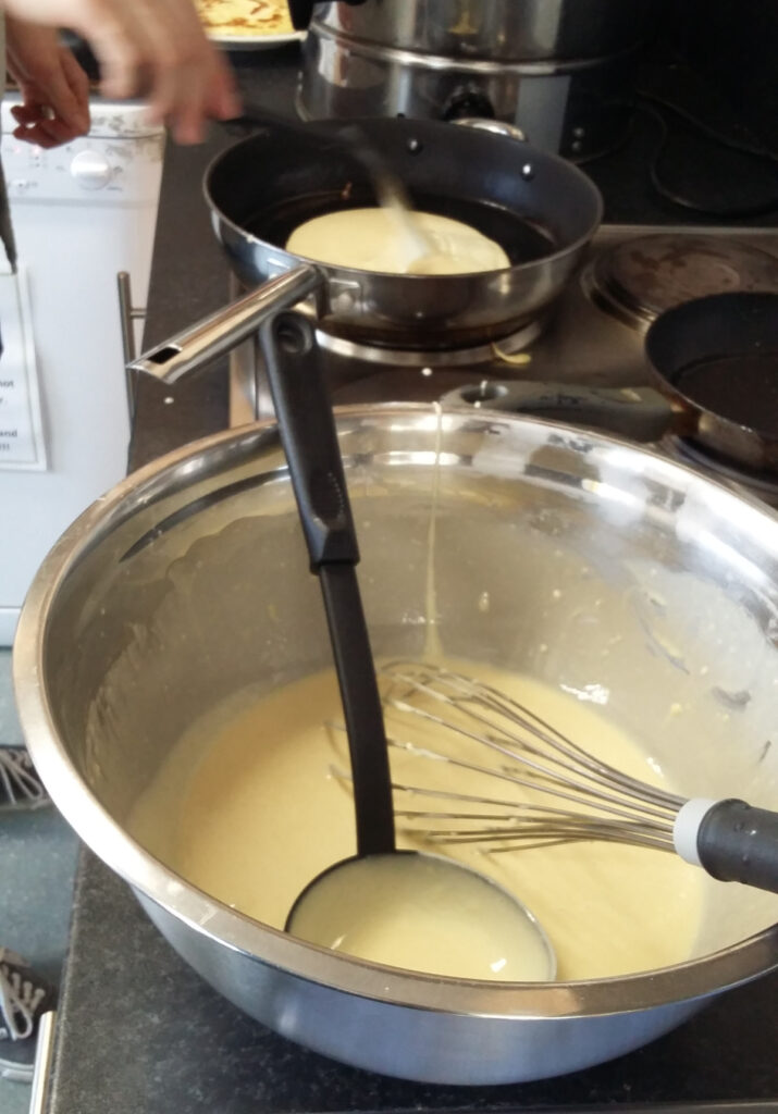 Photo of pancakes being mixed in a bowl